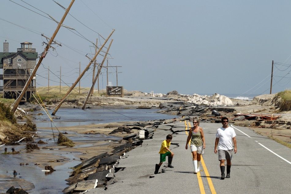 Residents walk along North Carolinas Highway 12 after Hurricane Irene