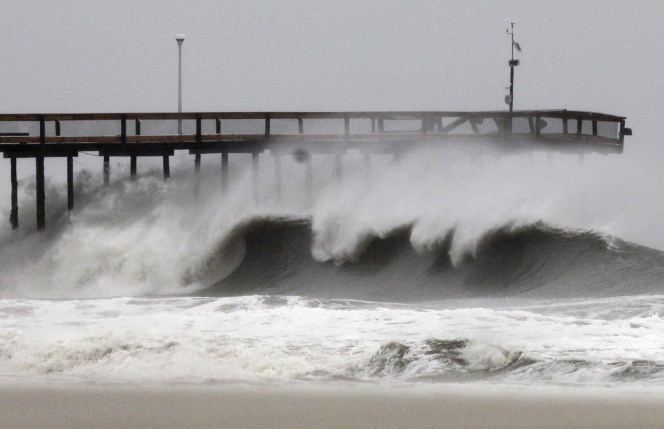 Waves break along the pier which was damaged during Hurricane Irene, in Ocean City