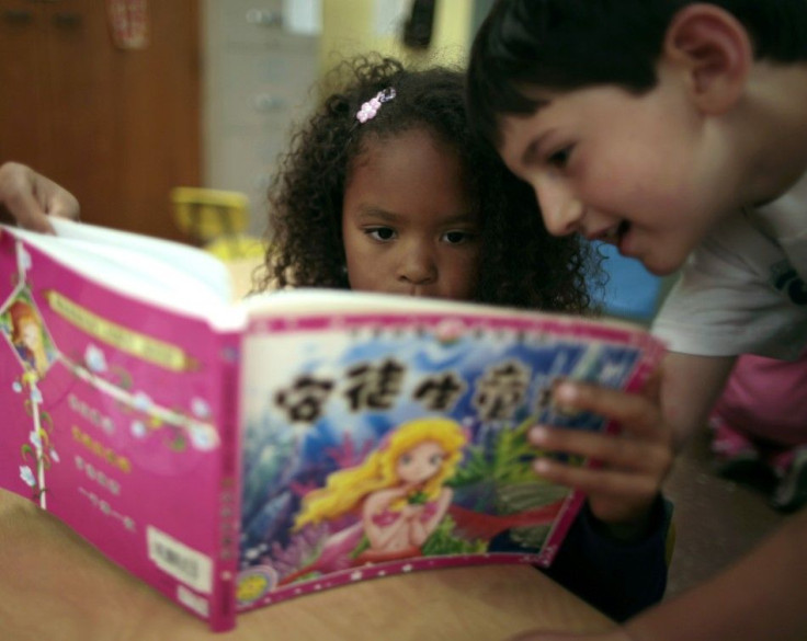 Aniya Cope and Ryan Goss, 5, read a Chinese book at Broadway Elementary School in Venice, Los Angeles