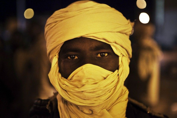 Black African refugee stands at the Libya-Egypt border