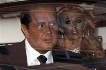 Petra Ecclestone, daughter of Formula One Supremo Bernie Ecclestone, and her boyfriend James Stunt (L) leave a hotel in downtown Rome
