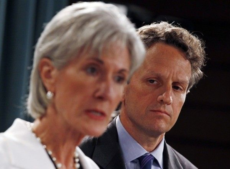 U.S. Treasury Secretary Timothy Geithner listens to Health and Human Services Secretary Kathleen Sebelius at a briefing on the Social Security and Medicare Trustees report. 