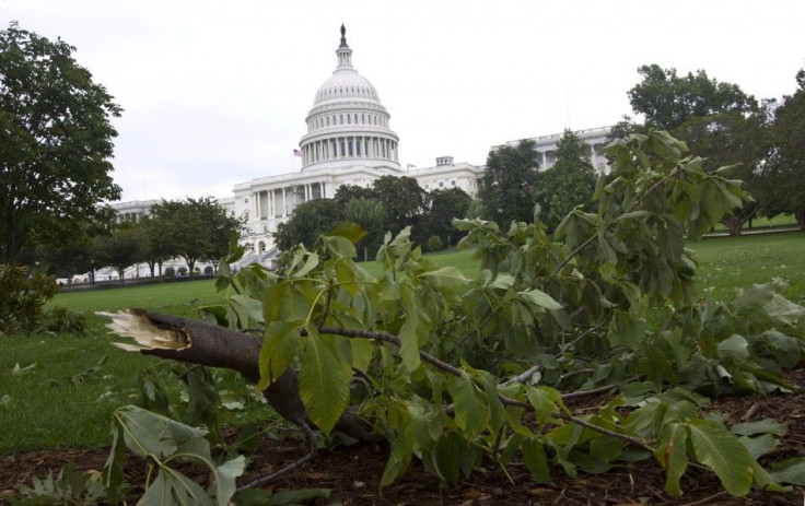 A tree limb lies on the ground in front of the U.S. Capitol the morning after Hurricane Irene passed by Washington