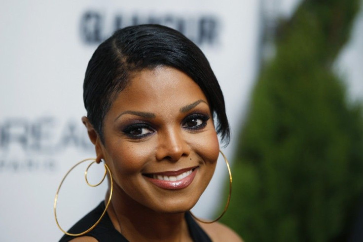 Singer Janet Jackson poses as she arrives to present a Glamour Magazine Woman of the Year award in New York