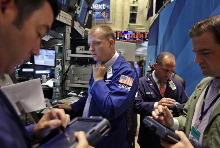 Traders work on the floor of the New York Stock Exchange