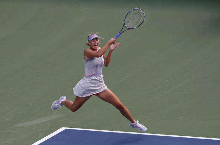 Maria Sharapova of Russia hits a return to Heather Watson of Britain during their match at the U.S. Open tennis tournament in New York