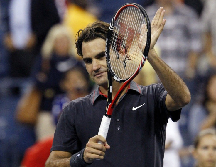 Federer of Switzerland celebrates defeating Giraldo of Colombia during the U.S. Open tennis tournament in New York