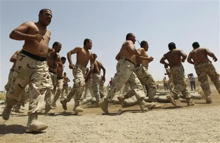 Kurdish Peshmerga cadets exercise during a 28-day course at an Iraqi military base in Kirkuk