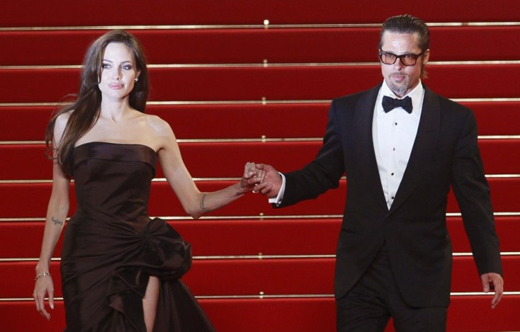 Cast member Pitt and actress Jolie leave the festival palace after the screening of the film The Tree of Life in competition at the 64th Cannes Film Festival