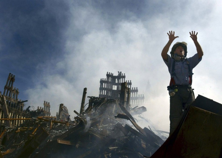 File picture shows a New York City fireman calling for more rescue workers to make their way into the rubble of the World Trade Center