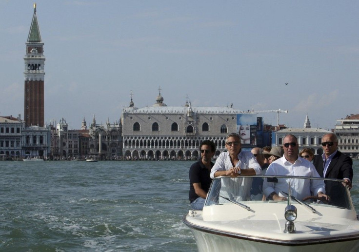 U.S. actor Clooney arrives by speedboat in Venice