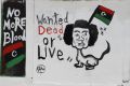 A caricature depicting Muammar Gadhafi is seen in Tripoli