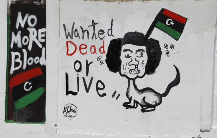 A caricature depicting Muammar Gadhafi is seen in Tripoli