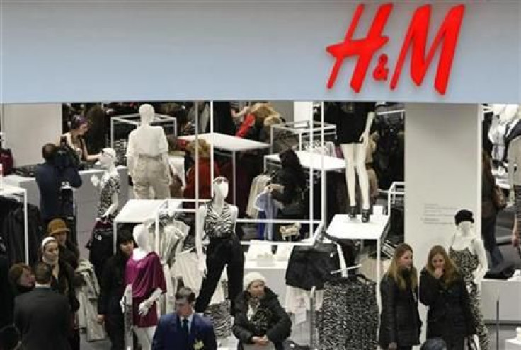 People shop in the newly opened Hennes & Mauritz (H&M) store in Moscow