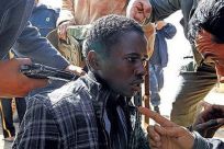 African migrant being questioned by Libyan rebels