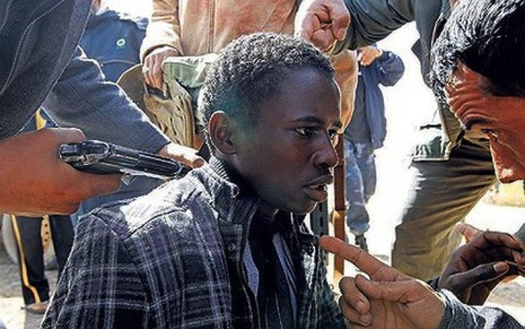 African migrant being questioned by Libyan rebels