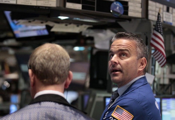 Traders work on the floor of the New York Stock Exchange