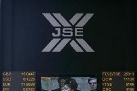 An electronic board displaying movements in major indices is seen at Johannesburg stock exchange in Sandton 