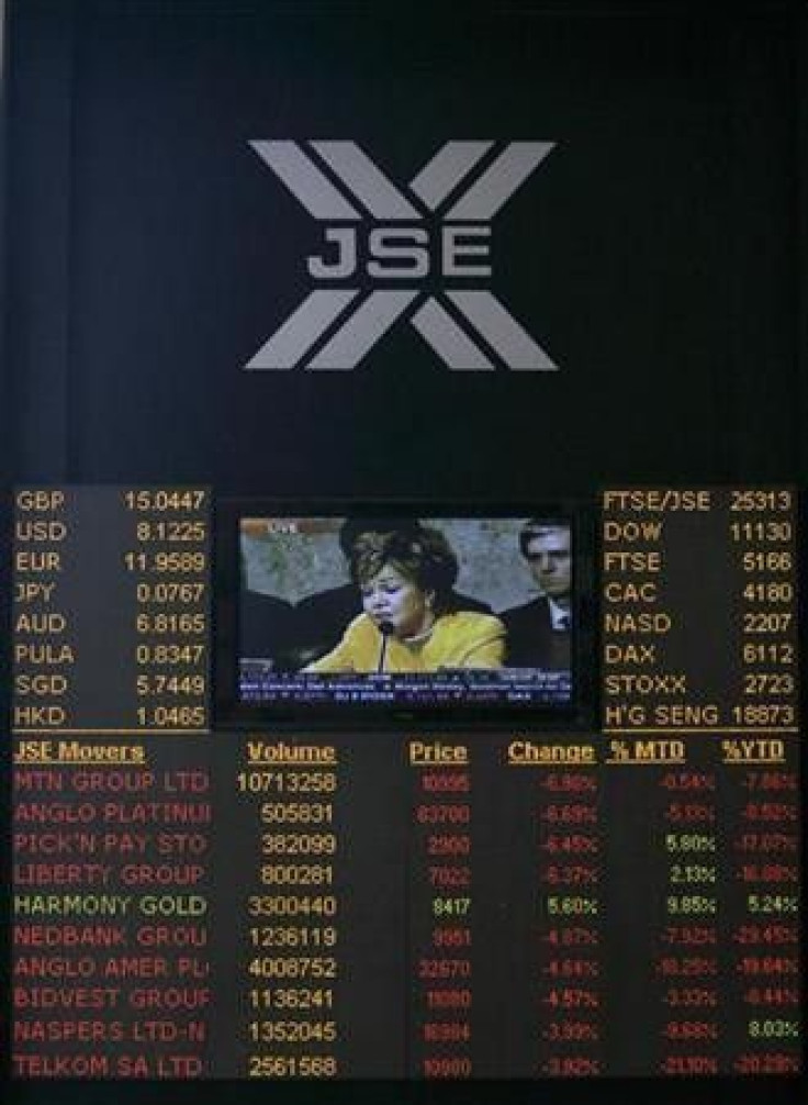 An electronic board displaying movements in major indices is seen at Johannesburg stock exchange in Sandton 