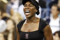 Williams of the U.S. reacts to a point during her first round match against Dolonts of Russia at the U.S. Open tennis tournament in New York
