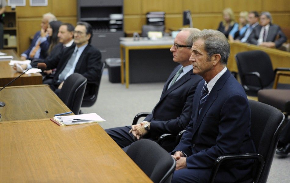 Actor Mel Gibson attends a hearing with his attorney Larry Ginsberg 2nd R in Los Angeles Superior Court to finalize financial issues in a custody battle with former girlfriend Oksana Grigorieva In Los Angeles