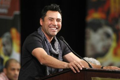 Boxing promoter De La Hoya smiles during a news conference at the MGM Grand Resort in Las Vegas