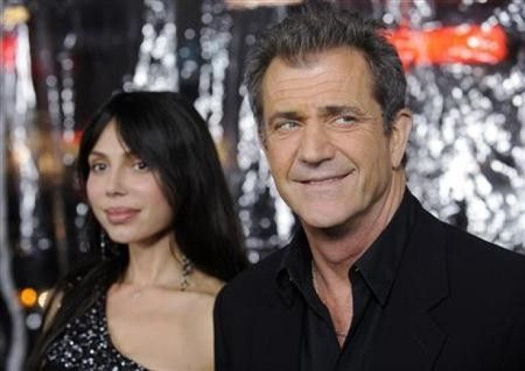 Cast member Mel Gibson (R) and Oksana Grigorieva attend the premiere of the film &#039;&#039;Edge of Darkness&#039;&#039; in Los Angeles