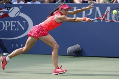 Christina McHale of the U.S. hits a return to Marion Bartoli of France during their match at the U.S. Open tennis tournament in New York