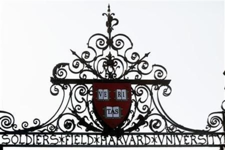 Harvard&#039;s seal sits atop a gate to the athletic fields at Harvard University in Cambridge, Massachusetts