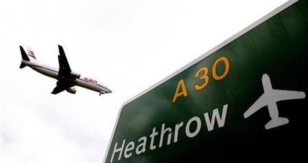 An aircraft prepares to land at Heathrow airport in London March 11, 2008. Londons crowded Heathrow airport could almost double airline charges in the next five years, boosting its debt-laden Spanish owner but sparking fury among airlines that fly from t