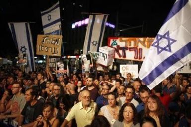 Demonstrators take part in a protest against the high cost of living and for social justice in Tel Aviv