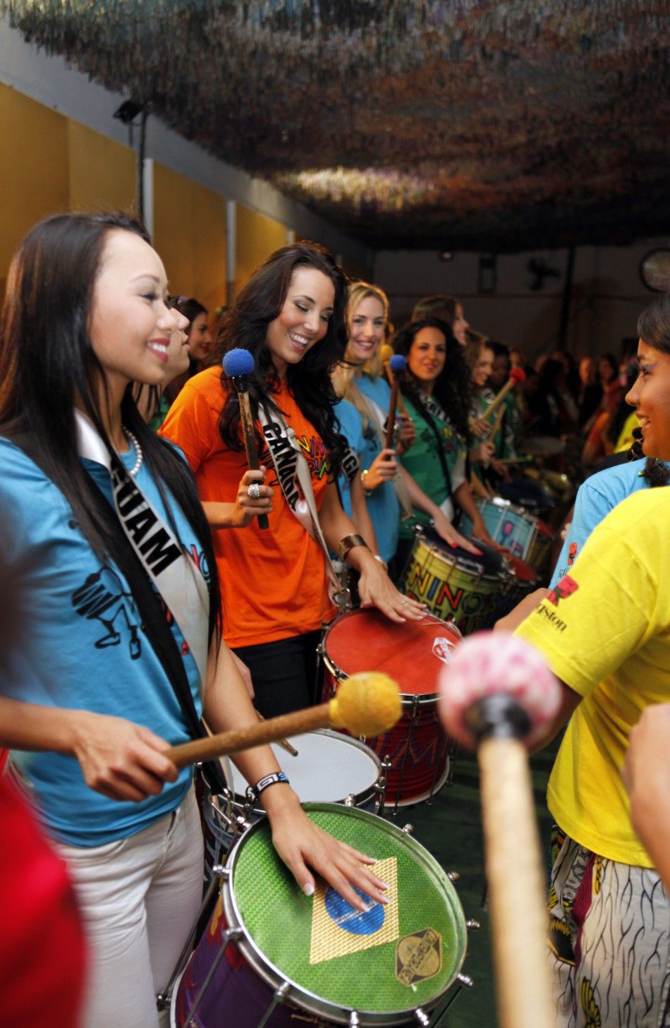 Miss Universe 2011 Stunning Contestants Dance to Help Slum Children in Brazil.