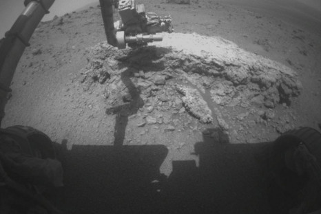 NASA&#039;s Mars Exploration Rover Opportunity used its front hazard-avoidance camera to take this picture showing the rover&#039;s arm extended toward a light-toned rock, &quot;Tisdale 2&quot;