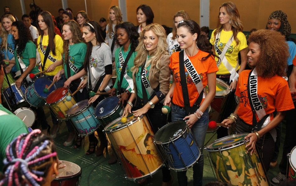 Miss Universe 2011 contestants attend a samba drums music class at Meninos do Morumbi non-governmental organization in Sao Paulo