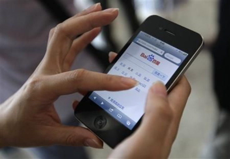 A user loads the Baidu homepage on her Apple iPhone 4 during the Baidu 2011 technology innovation conference in Beijing