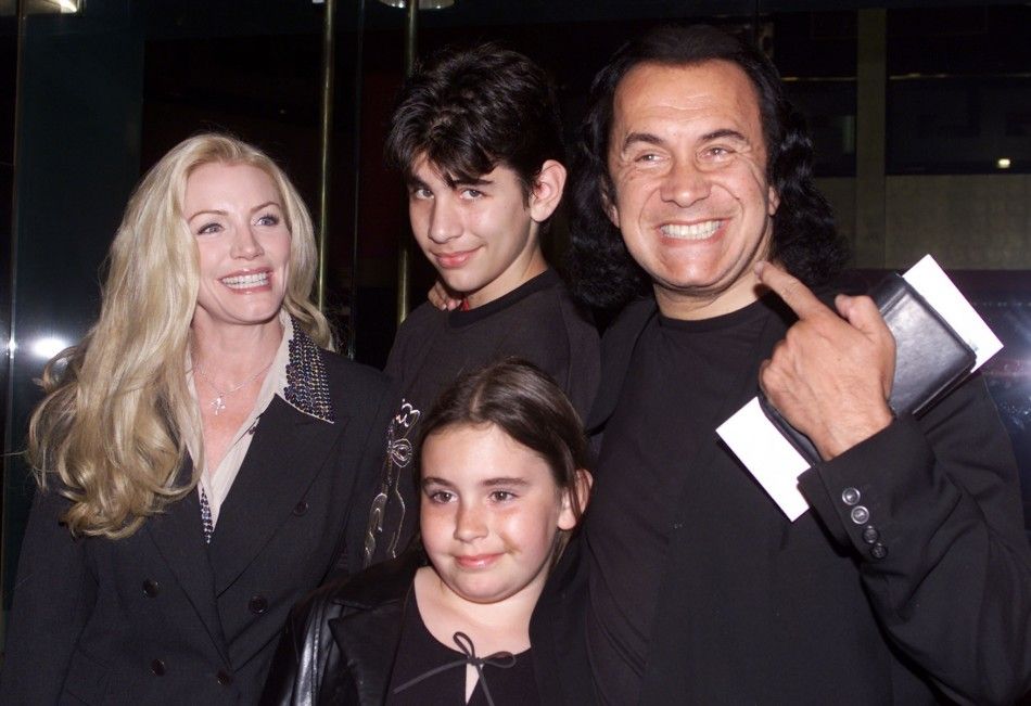 Gene Simmons of the rock group quotKISSquot poses with his family, companion Shannon Tweed L and their children Nicholas and Sophie as they arrive as guests for the premiere of the new comedy film quotThe New Guyquot in Hollywood, May 7, 2002.