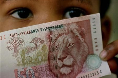 A South African child holds a 50 rand note in a file photo.