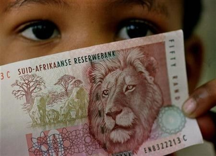 A South African child holds a 50 rand note in a file photo.