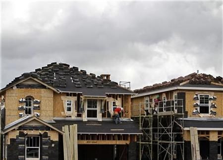 A construction worker works on one of a number of new single family homes in a subdivision outside San Diego as building returns to San Marcos