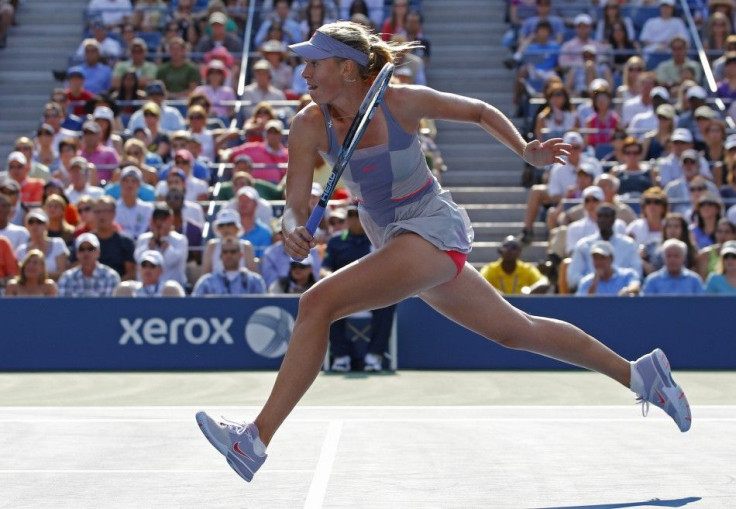 Maria Sharapova of Russia runs for a shot from Flavia Pennetta of Italy during their match at the U.S. Open tennis tournament in New York