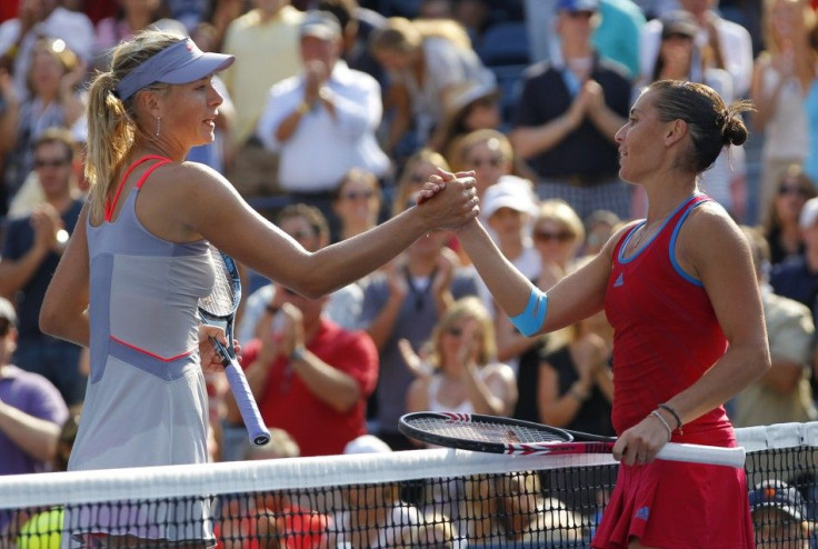 Flavia Pennetta of Italy celebrates after defeating Maria Sharapova of Russia during their match at the U.S. Open tennis tournament in New York