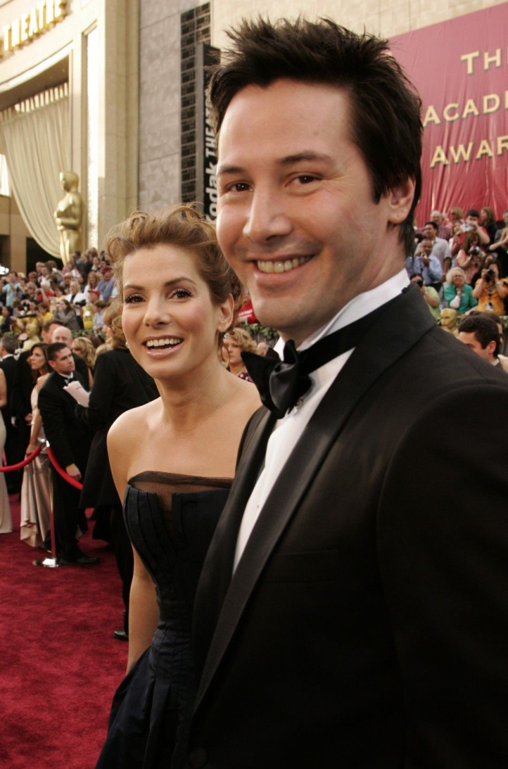 U.S. actors Sandra Bullock (L) and Keanu Reeves arrive for the 78th annual Academy Awards in Hollywood 