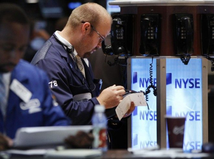 Traders work on the floor of the New York Stock Exchange in New York