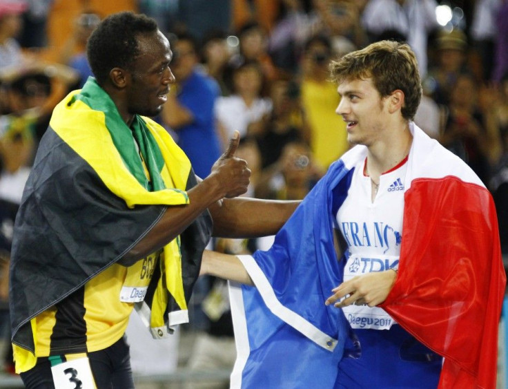 Usain Bolt of Jamaica congratulates Christophe Lemaitre of France after the men's 200 metres final at the IAAF World Athletics Championships in Daegu