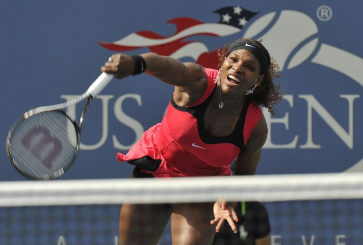 Serena Williams of the U.S. hits a serve to Michaella Kajicek of the Netherlands during their match at the U.S. Open tennis tournament in New York