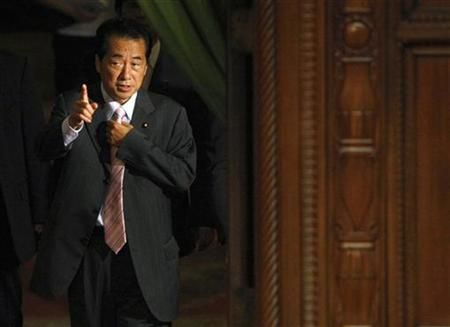 Japans Deputy Prime Minister Naoto Kan arrives at a lower house plenary session at Parliament in Tokyo