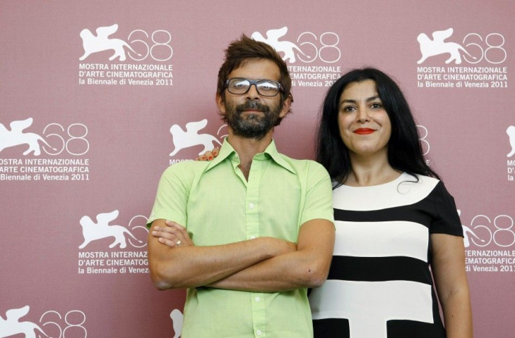 Directors Paronnaud and Satrapi pose during a photocall of their film &quot;Poulet aux prunes&quot; at the 68th Venice Film Festival