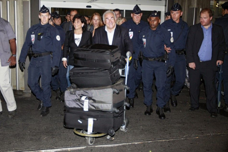 Former IMF chief Strauss-Kahn and wife Sinclair arrive at Charles-de-Gaulle airport in Roissy near Paris