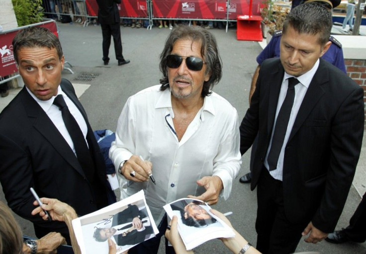 Director and actor Al Pacino signs autographs as he leaves after a news conference of his film &quot;Wilde Salome&quot; at the 68th Venice Film Festival