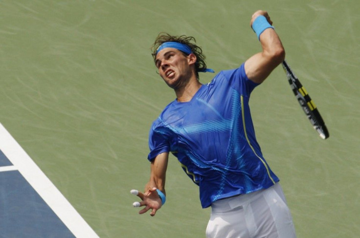 Rafael Nadal of Spain serves to David Nalbandian of Argentina during their match at the U.S. Open tennis tournament in New York